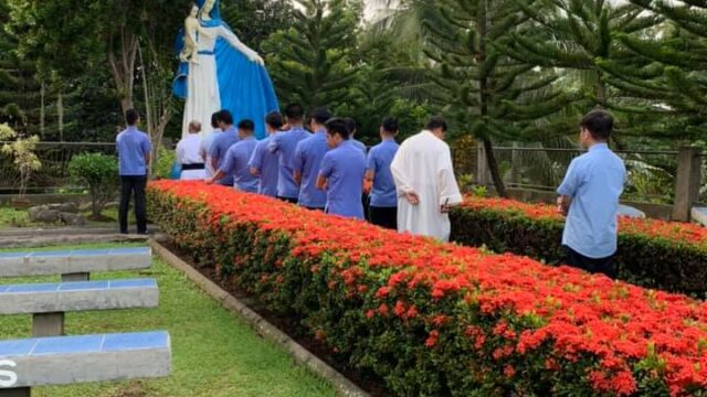 Vocationist Religious pray by the Statue of Our lady of Divine Vocations in Davao, Philippines